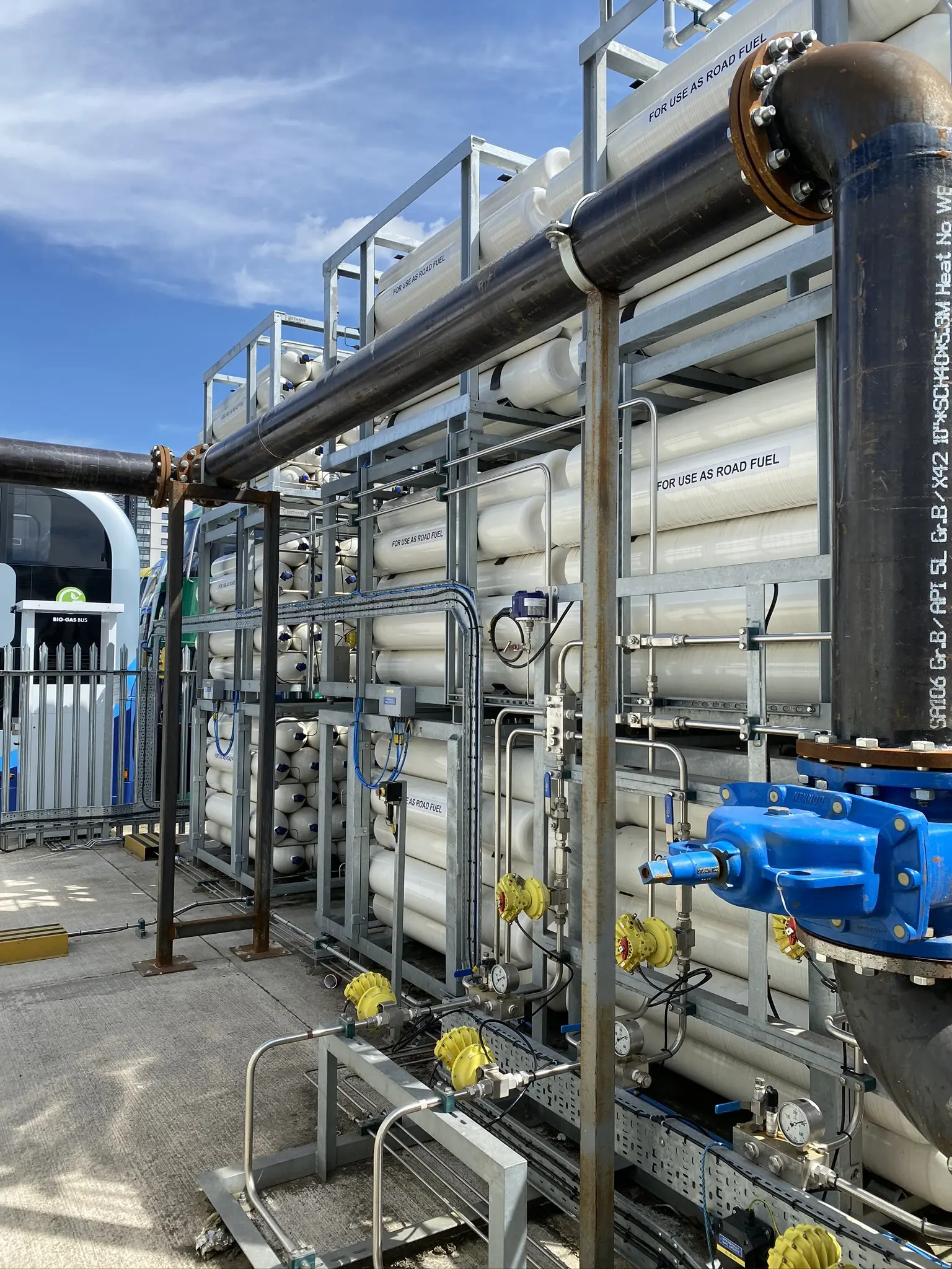 A setup for Bio-LNG and Bio-CNG gas storage and refuelling designed for UK HGV fleets, featuring gas cylinders and piping.