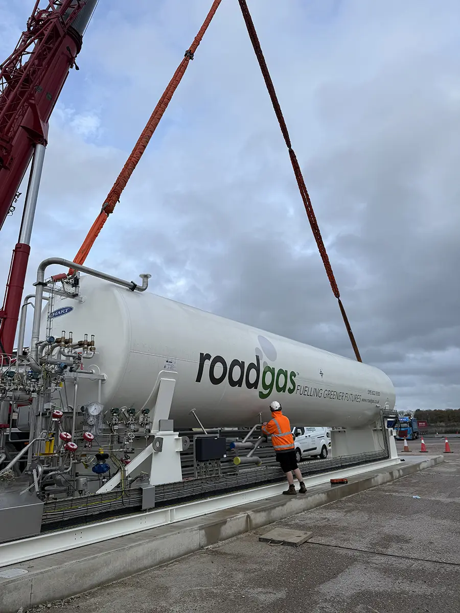 Technician operating equipment at a Roadgas Bio-LNG refuelling station, showcasing the infrastructure for renewable gas supply for UK HGV fleets.