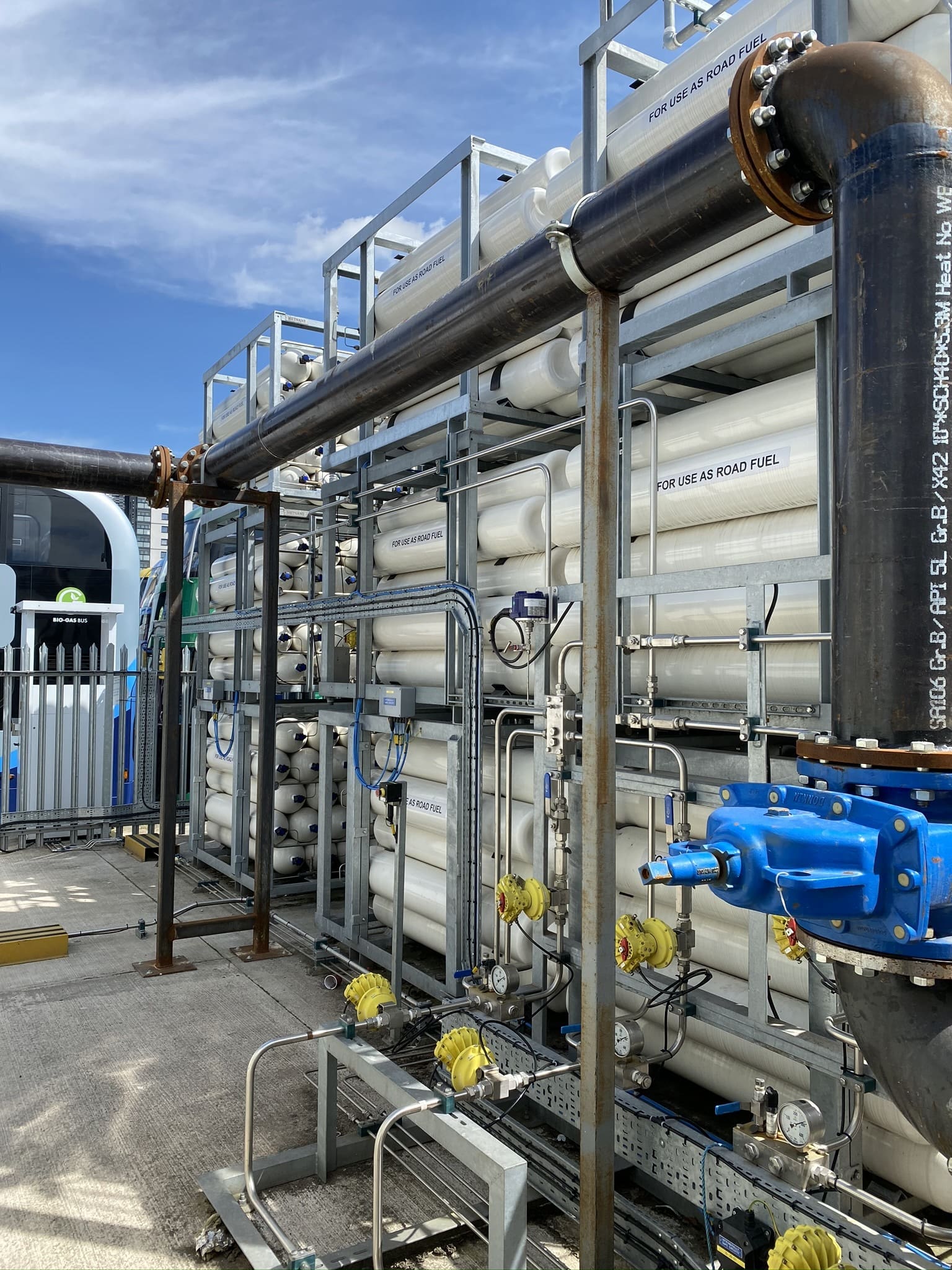 A setup for Bio-LNG and Bio-CNG gas storage and refuelling designed for UK HGV fleets, featuring gas cylinders and piping.