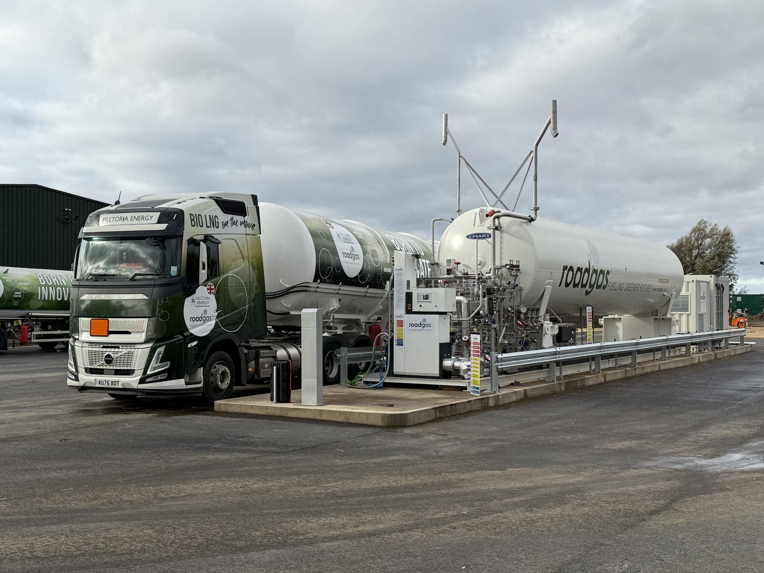 A Roadgas Bio-LNG refueling station featuring a gas truck and storage tanks, designed for lower-carbon transport solutions.